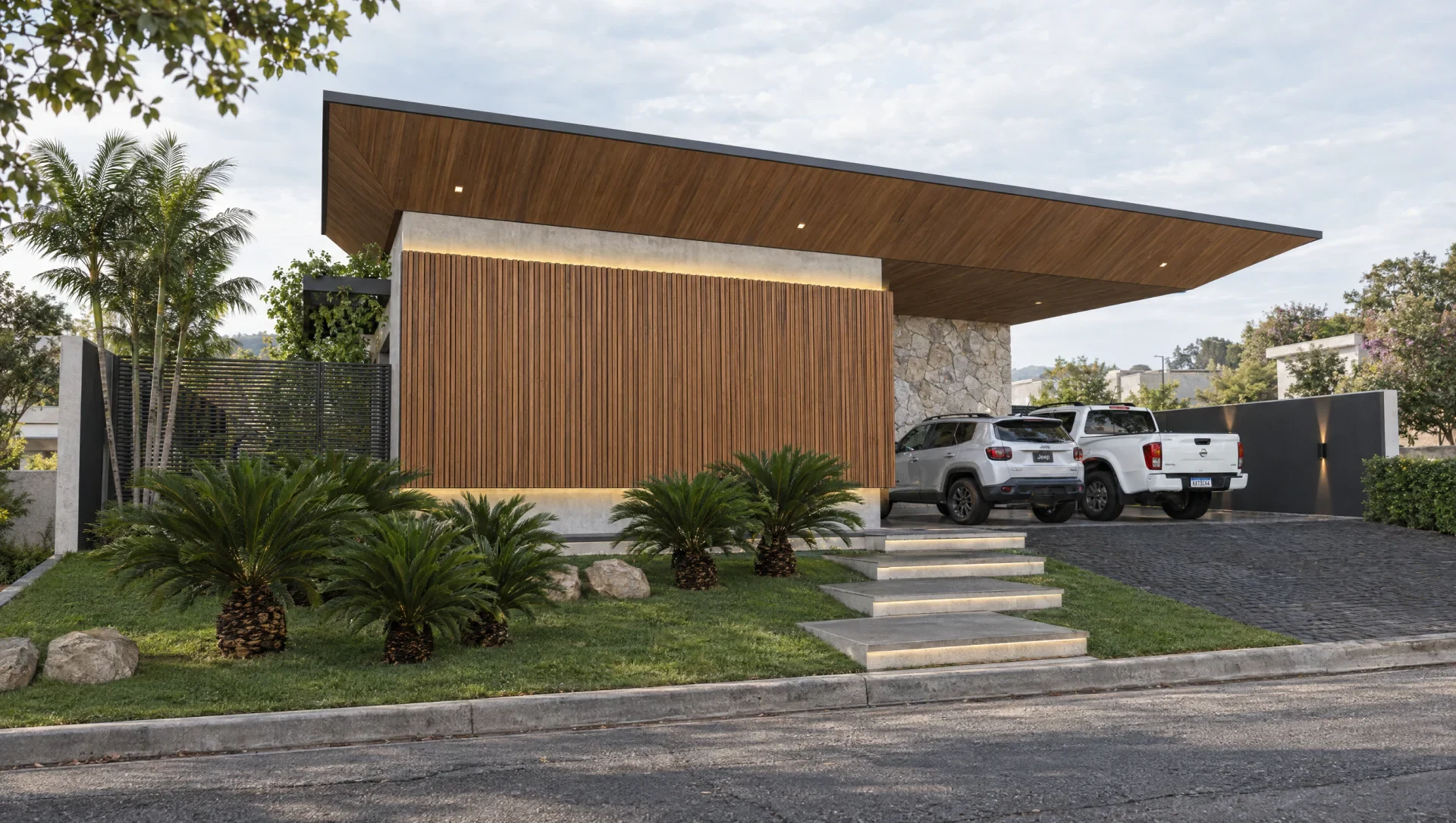 Residência contemporânea com fachada de madeira, pedra, jardim e grande cobertura